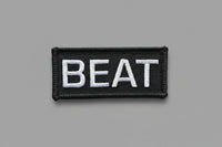 Black and white 'BEAT' patch