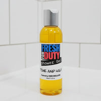 Bottle of Fresh for Duty shower gel on a tiled bathroom wall.